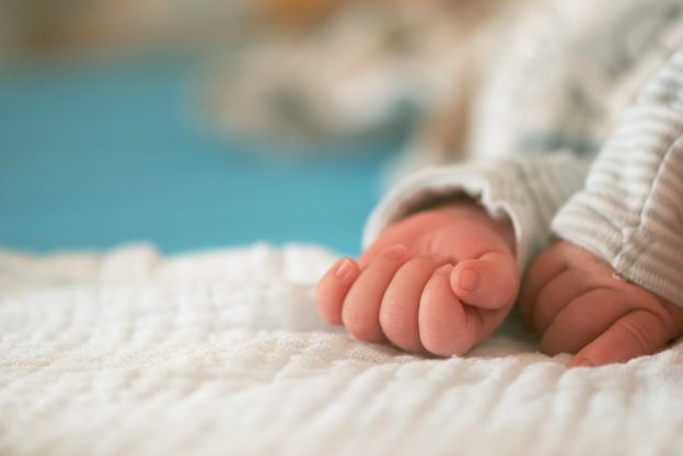 Newborn baby hands close up